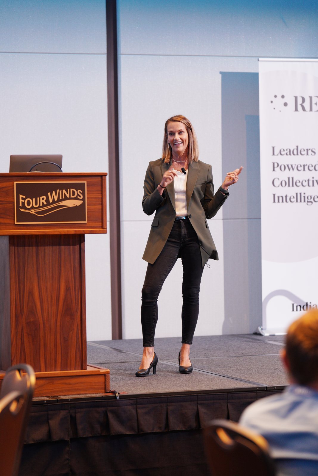 Angie Carel speaking on stage