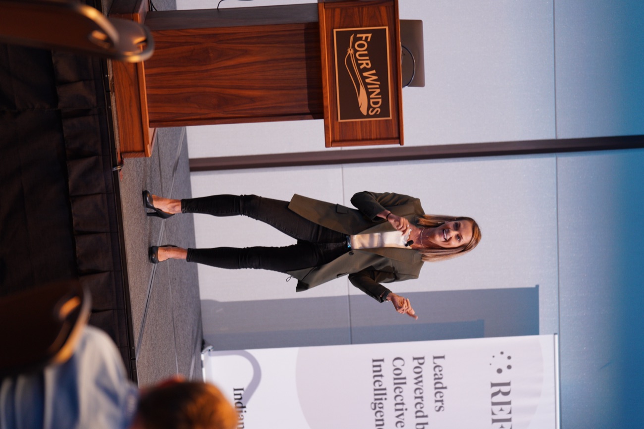 Angie Carel presenting at the podium