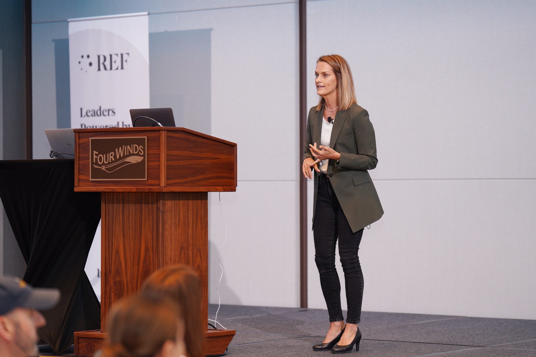 Angie Carel delivering a keynote on stage